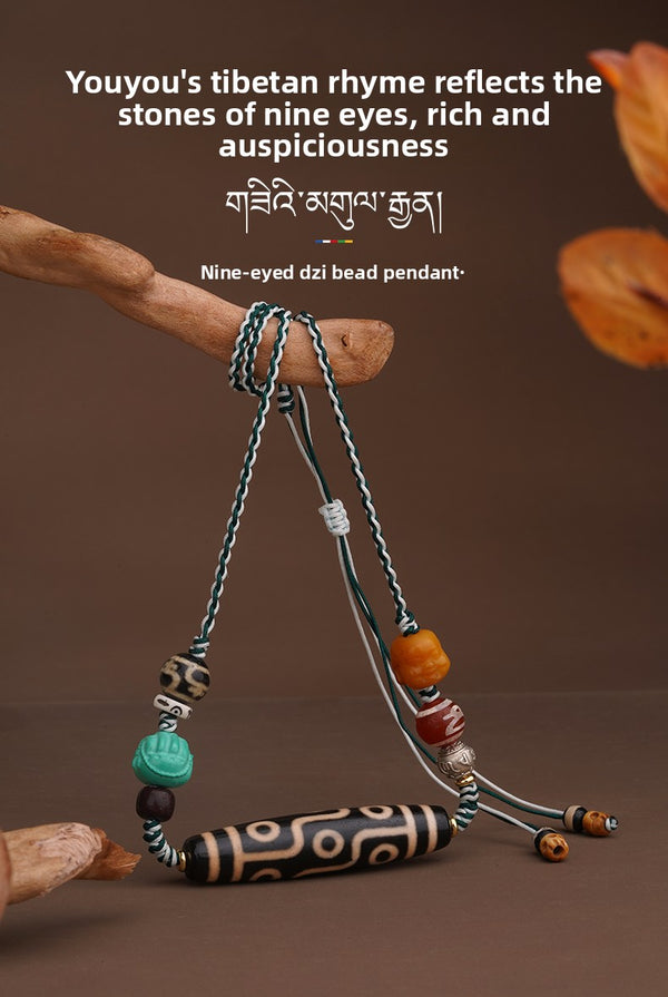 Nine‑Eyed Dzi Bead Pendant